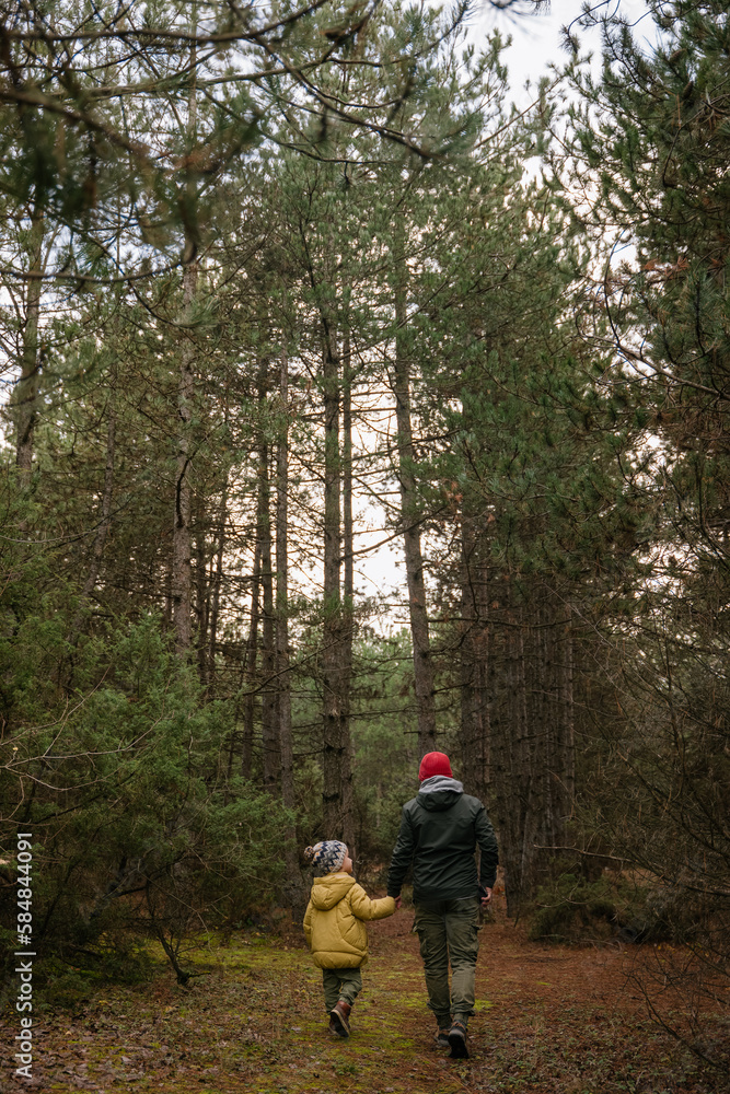 Father and son in the woods Father and son in the woods