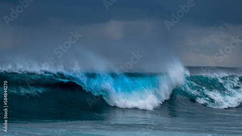 Perfect turquoise wave breaking photo