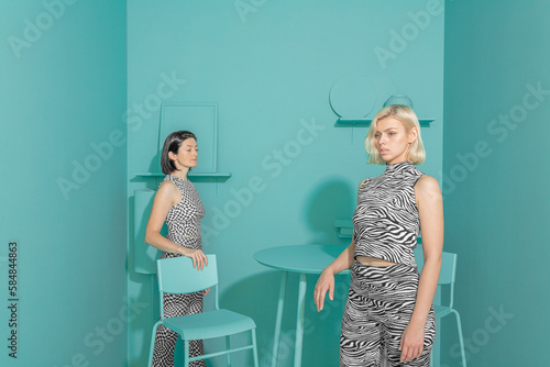 Conceptual portrait of a loving couple of thoughtful girls in 3d style