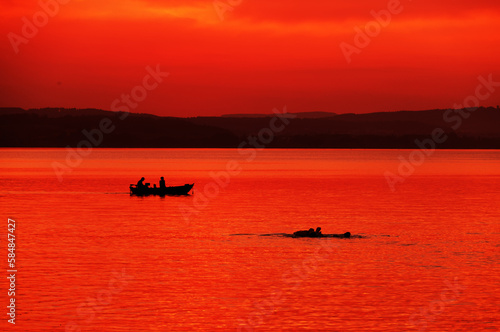 Tourists enjoying the sunset at Sempach lake in Switzerland, Europe © Rechitan Sorin