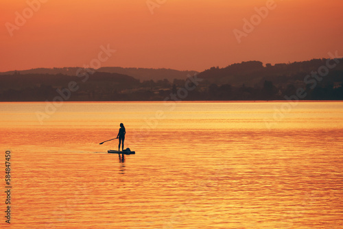 Tourists enjoying the sunset at Sempach lake in Switzerland, Europe © Rechitan Sorin