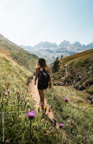 Girl doing a hike through the pyrenees mountains. photo