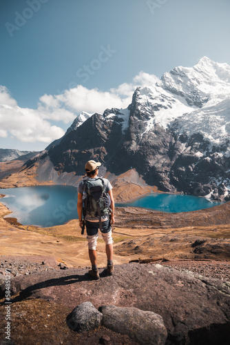 Man watching a beautiful landscape in the ausangate trekking in the Andes mountains.