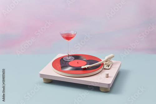 Turntable with heart-shaped plate with cocktail. photo