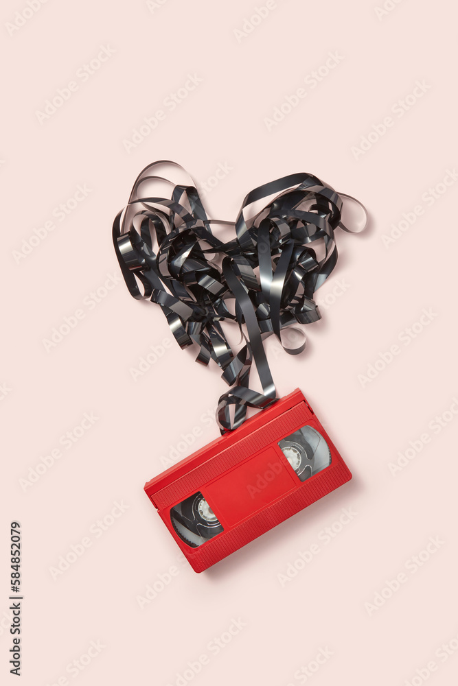 Red VHS cassette with black tape shaped like heart. Stock Photo | Adobe ...