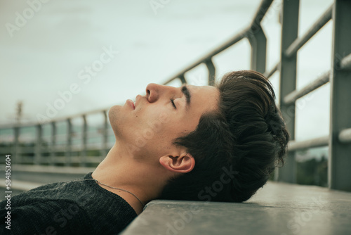 portrait of handsome guy lying down 
