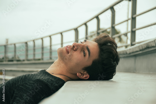 portrait of handsome guy lying down 