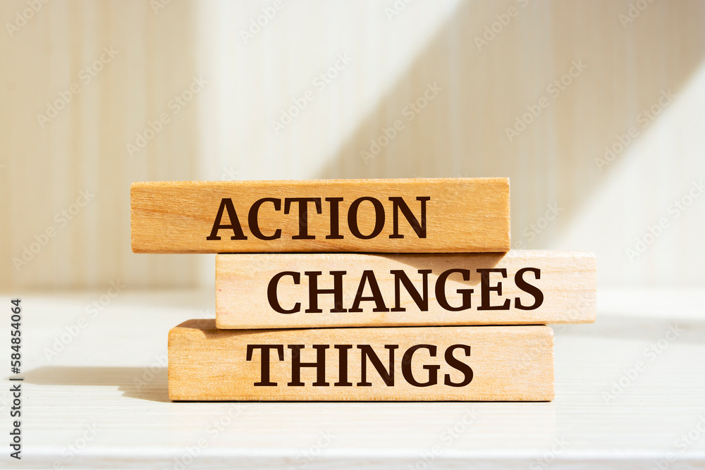 Wooden blocks with words 'Action Changes Things'. Wooden blocks with words 'Action Changes Things'.