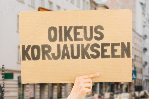 Wallpaper Mural The phrase " Right to repair " and the repair icon are drawn on a carton banner in men's hands. Product fixing. Fix a product. Guarantee. Client service Torontodigital.ca