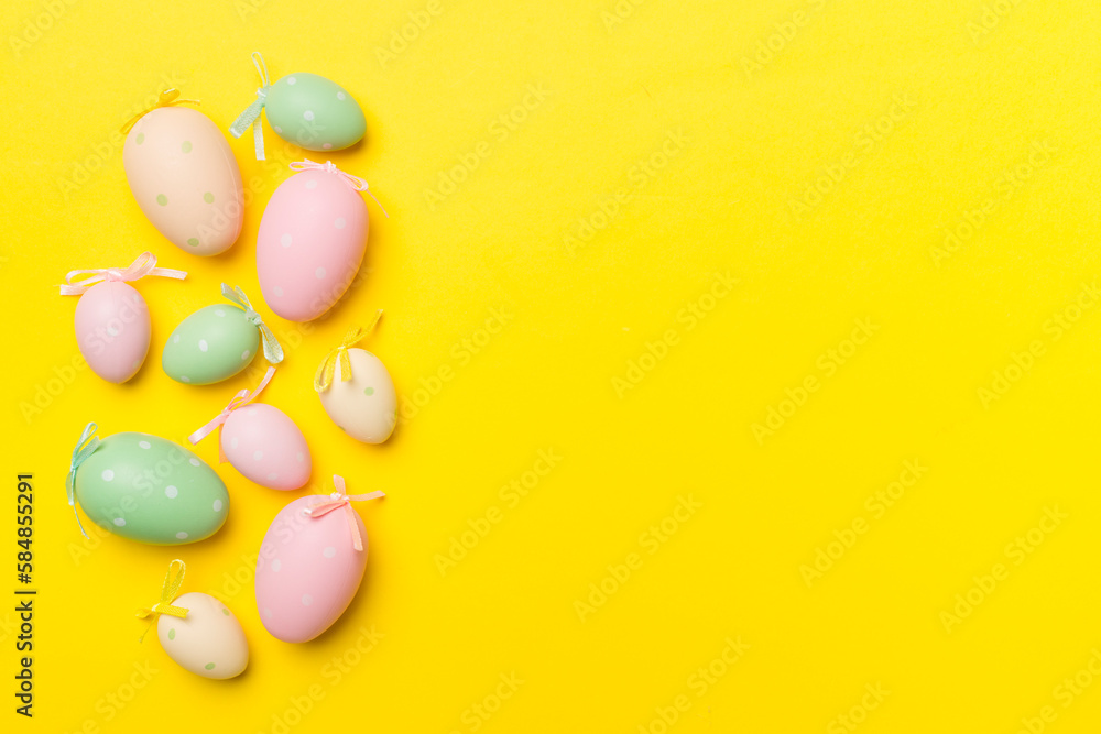 Cute easter eggs on color background, top view