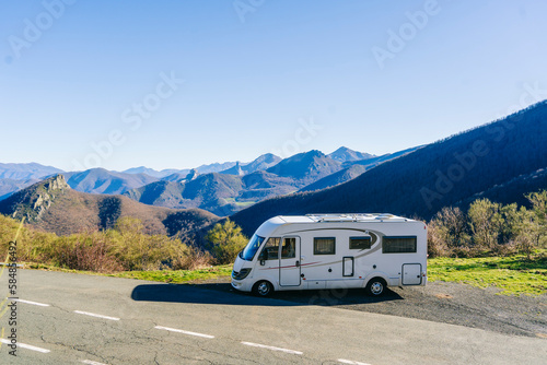 Panoramic view of a mountain landscape with a rv vehicle