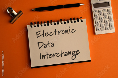 There is a notebook with the word Electronic Data Interchange. It is eye-catching image. photo