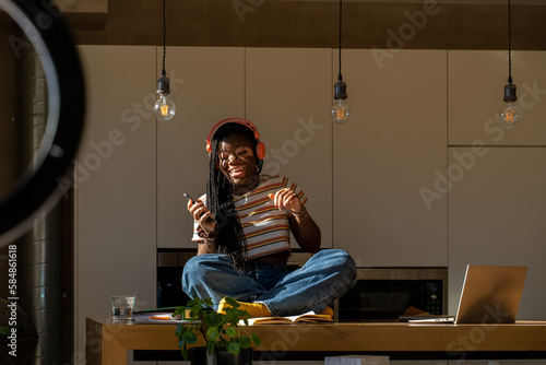 Teen dancing in the kitchen photo