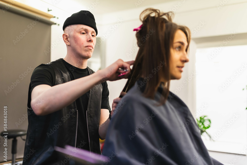 Hairdresser working on woman's hair