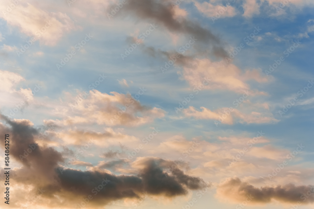 Fairy sunset sky with fluffy clouds. Sunset sky natural background. Dramatic Sky. Sunset In Yellow, Orange, Pink Colors. Feeling of dream or freedom. Copy space Fairy sunset sky with fluffy clouds. Sunset sky natural background. Dramatic Sky. Sunset In Yellow, Orange, Pink Colors. Feeling of dream or freedom. Copy space