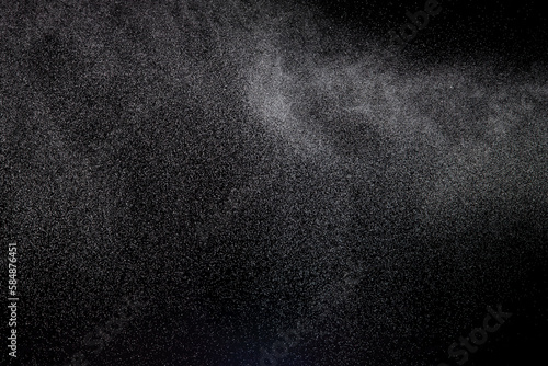 Million of Star Dust, Photo image of falling down shower rain snow, heavy snows storm flying. Freeze shot on black background isolated overlay. Spray water fog smoke as star particle on wind