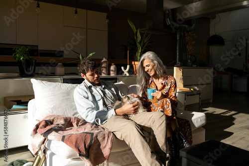 Senior mother and adult son at home photo