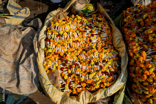A large bag of marigold flowers for sale on the street in India photo
