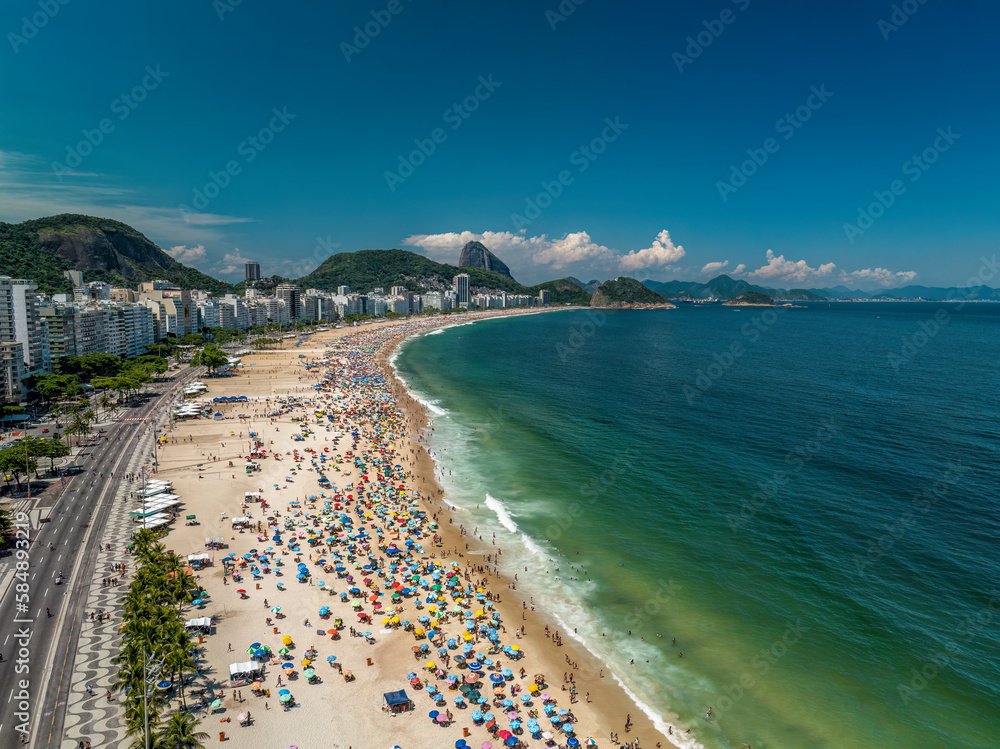Aerial view of Copacabana Beach on sunny summer day. City skyline, Rio de Janeiro, Brazil	