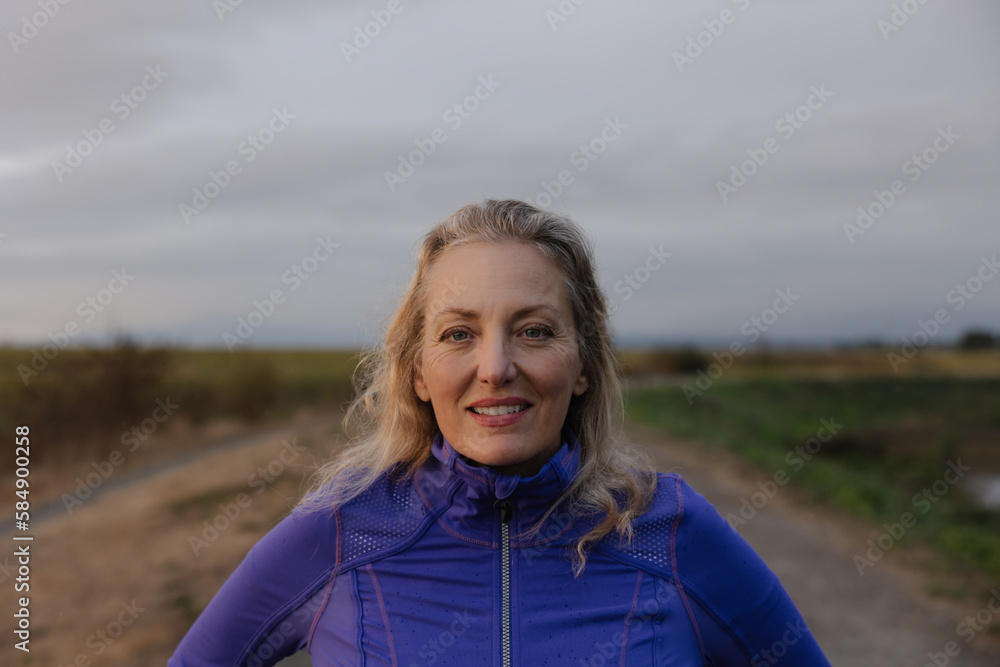 Smiling portrait of active woman outside.