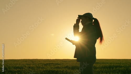 Agriculture. farming concept. farmer agronomist field wheat works in the tablet at sunset. farmer silhouette. market partnership camera researcher american greenhouse land back smile smartphone