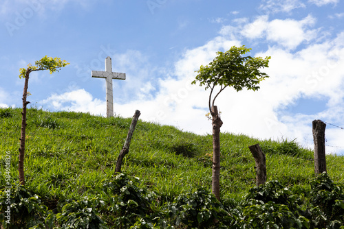 Single Christian Cross on Hill Outdoors in summer  photo