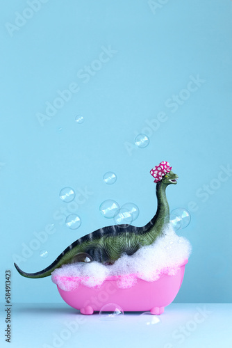 Dinosaur enjoying a bubble bath photo