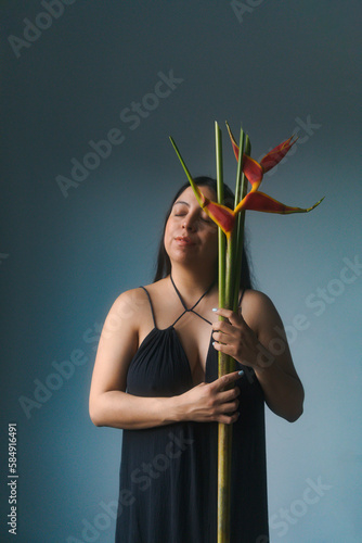 portrait of a woman with a flower in her hand photo