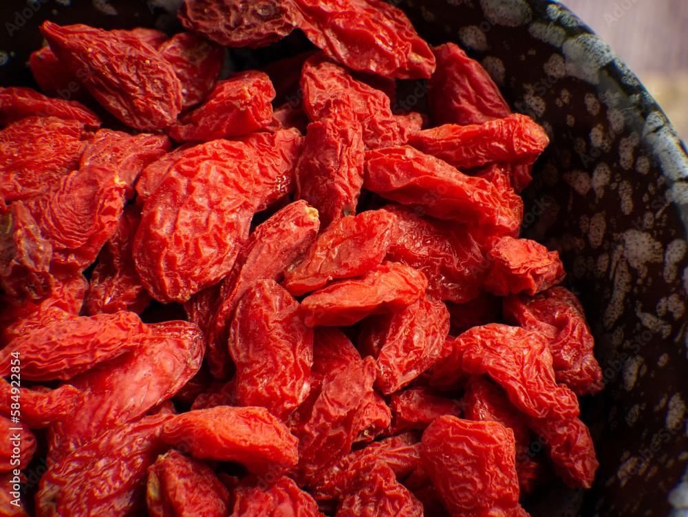The goji on wood table for food or health concept The goji on wood table for food or health concept