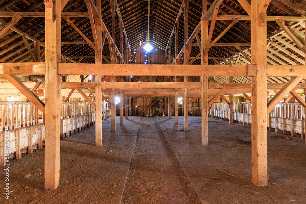 Fototapeta premium Historic Barn Interior with Wooden Beams at Pierce Point Dairy Farm