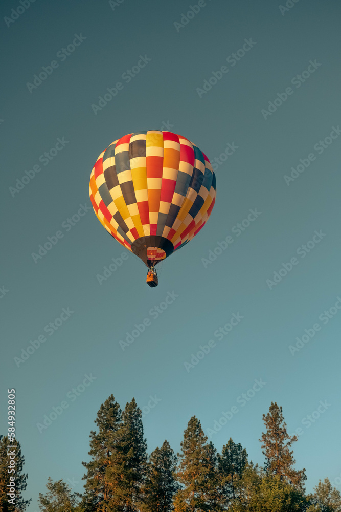 Hot Air Balloon Among Bright Blue Sky Hot Air Balloon Among Bright Blue Sky