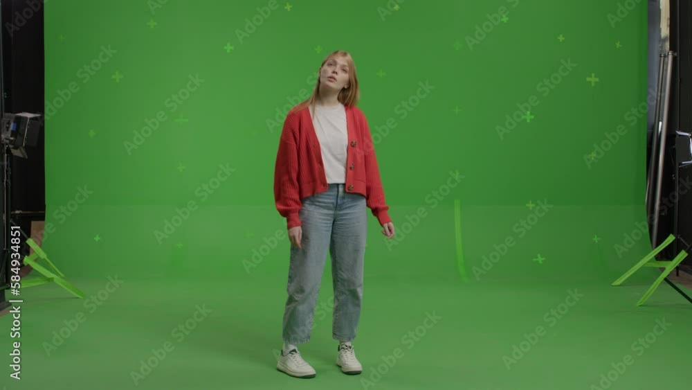 GREEN SCREEN CHROMA KEY CU Portrait of 20s Caucasian female student pretending she is visiting art exhibition GREEN SCREEN CHROMA KEY CU Portrait of 20s Caucasian female student pretending she is visiting art exhibition