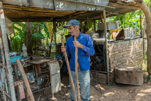 Banana Grower Checking His Cultivation Tool.