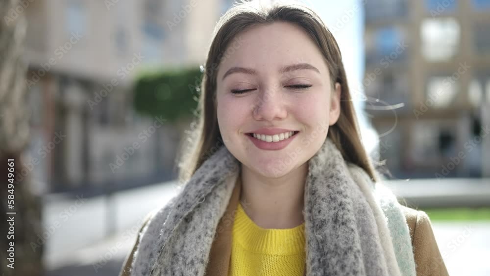 Young blonde woman smiling confident standing at street Young blonde woman smiling confident standing at street