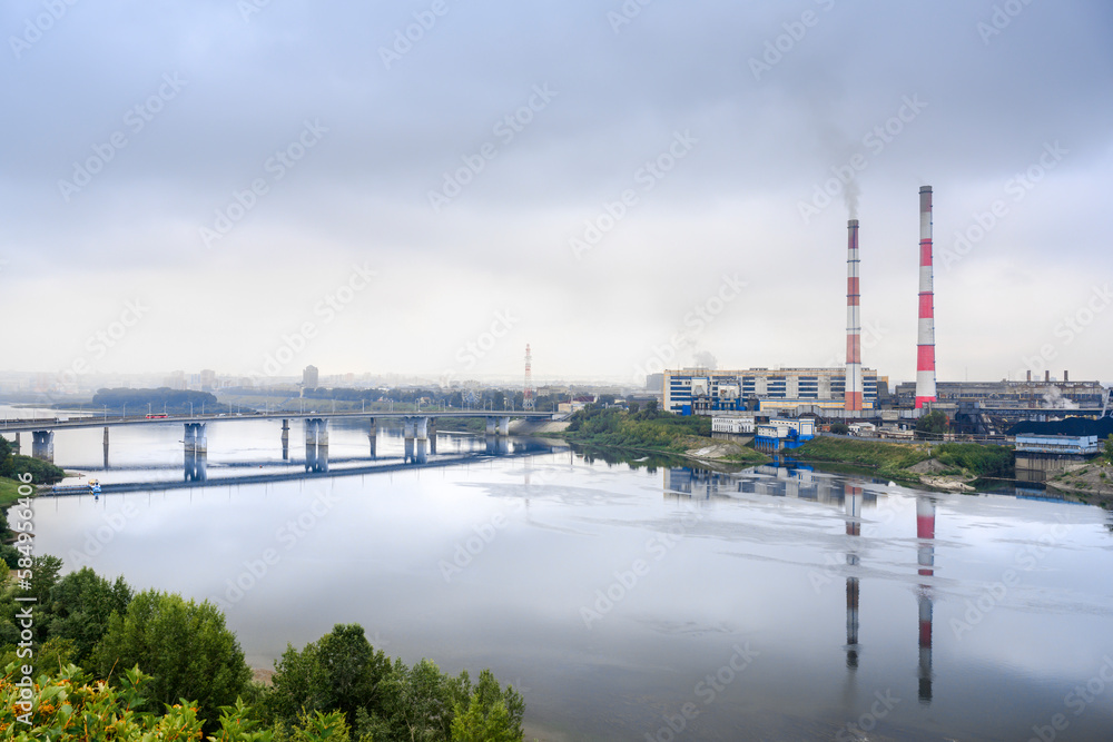 View of the Tom River and the thermal power plant in Kemerovo in fog