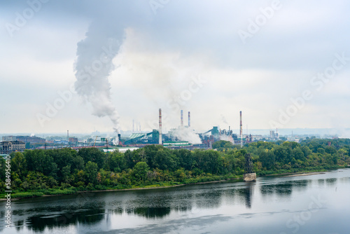 View of the Tom River and the Cox-Chemical Plant in the city of Kemerovo in fog photo