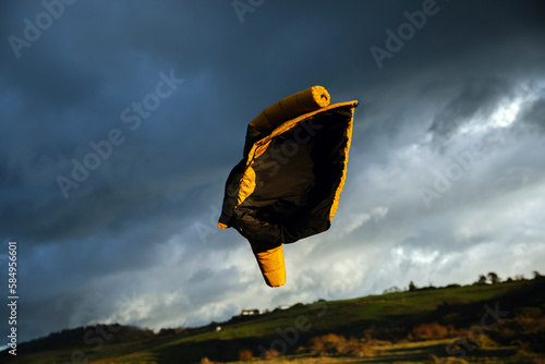 a yellow jacket in the air  photo