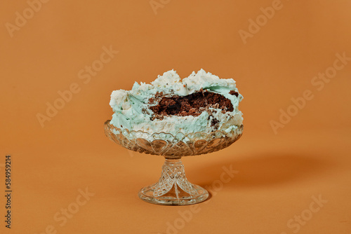 cake stand with the remains of a cake photo
