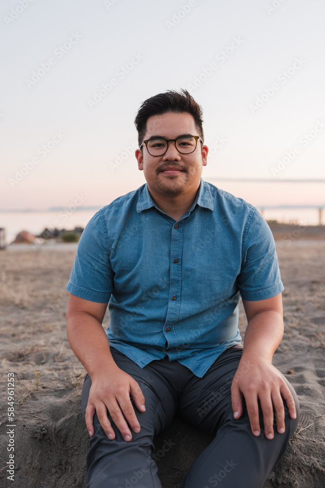 Simple portrait of man sitting outside in the evening. Simple portrait of man sitting outside in the evening.