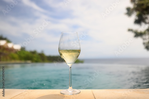 white wine tasting  chilled ice wine in a cold glass in summer