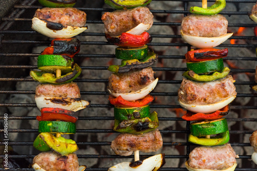 Sausage skewers on a grill photo