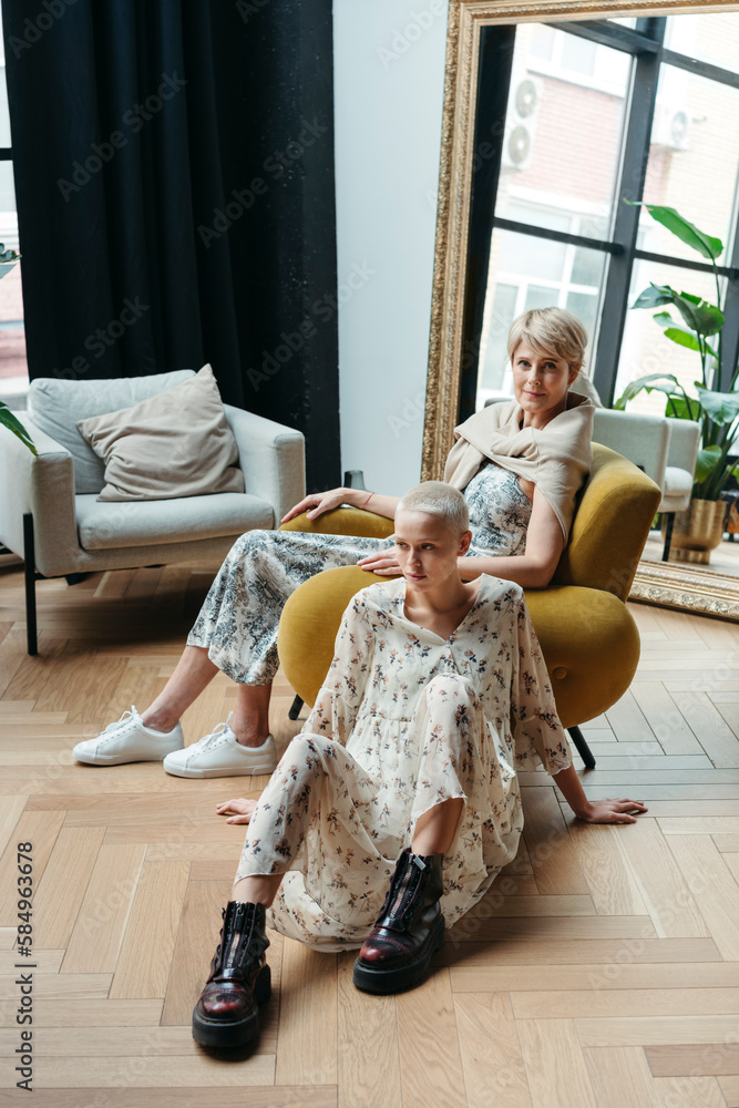 © Irina Polonina/Stocksy - Two beautiful women of different ages in apartment. © Irina Polonina/Stocksy - Two beautiful women of different ages in apartment.