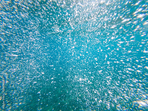 many bubbles under water photo