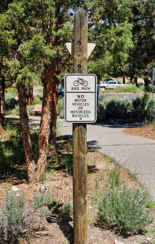 A Bike Path, No Motor Vehicles of Motorized Bicycles sign. photo