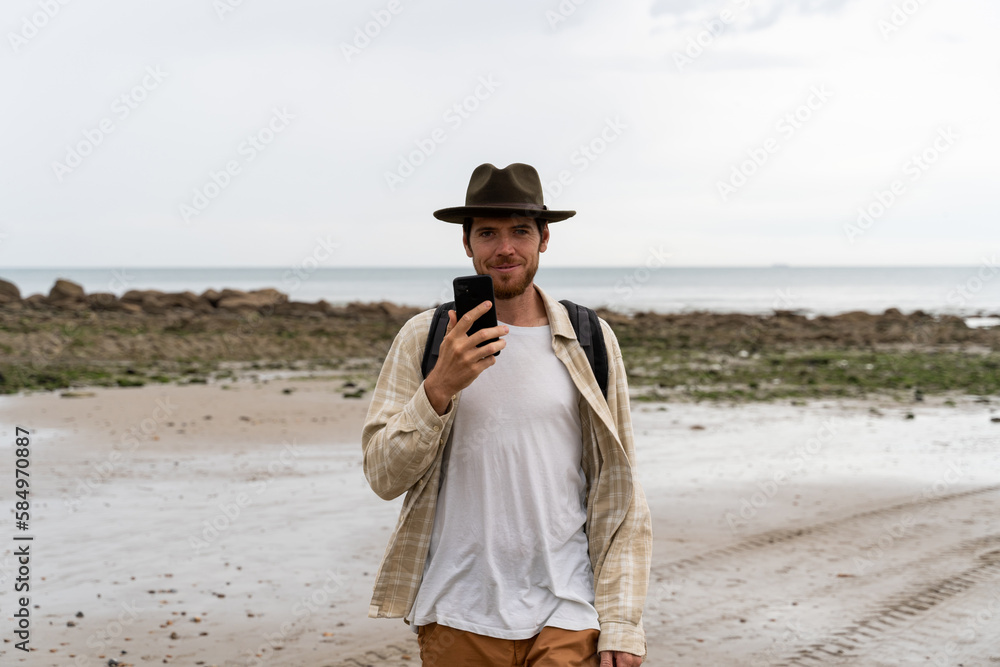 man with phone at beach man with phone at beach