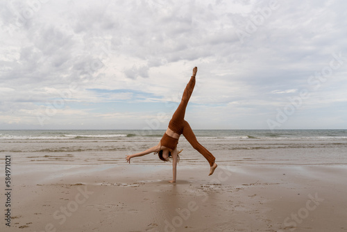 cartwheel woman at beach photo
