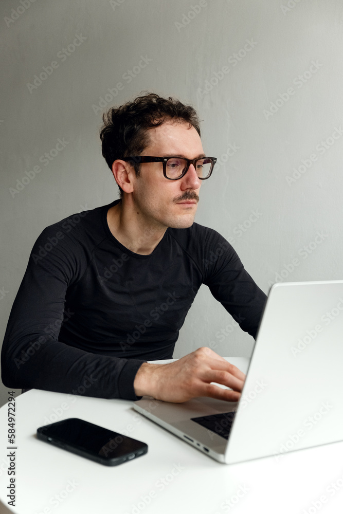 A man sitting and working A man sitting and working