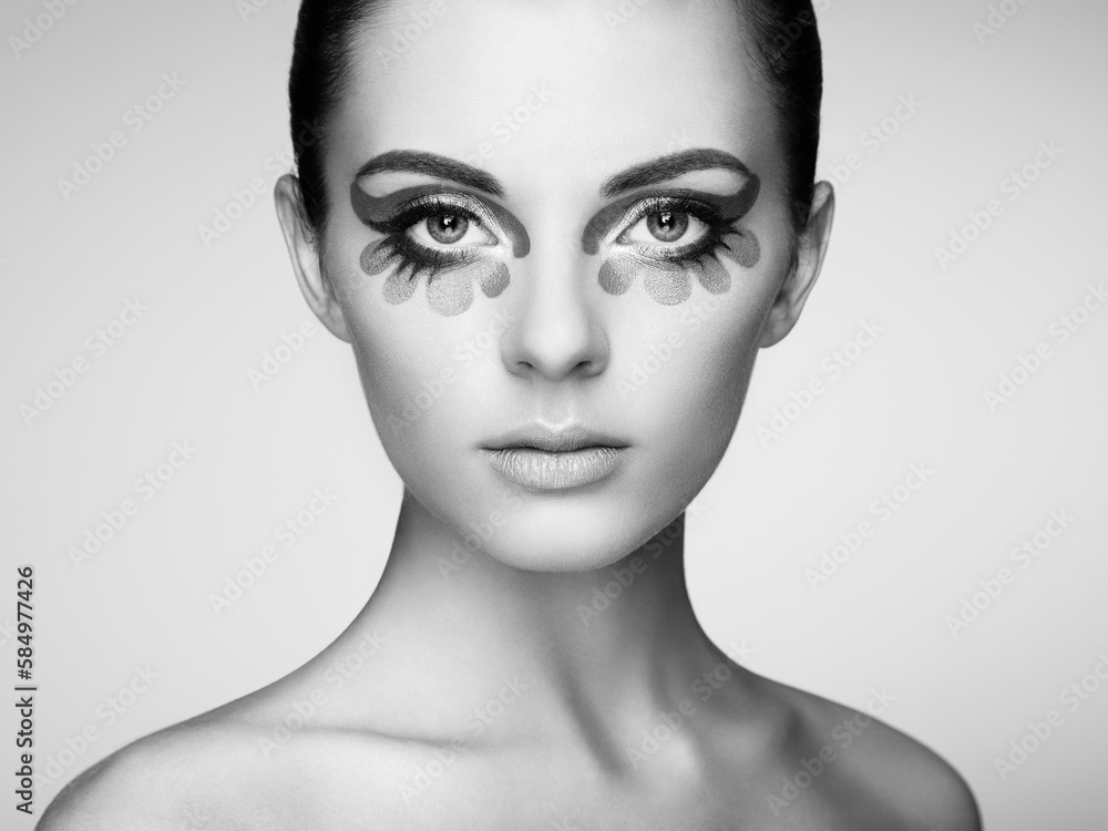 Fototapeta premium Beautiful woman face. Perfect makeup. Beauty fashion. Eyelashes. Cosmetic Eyeshadow. Black and white