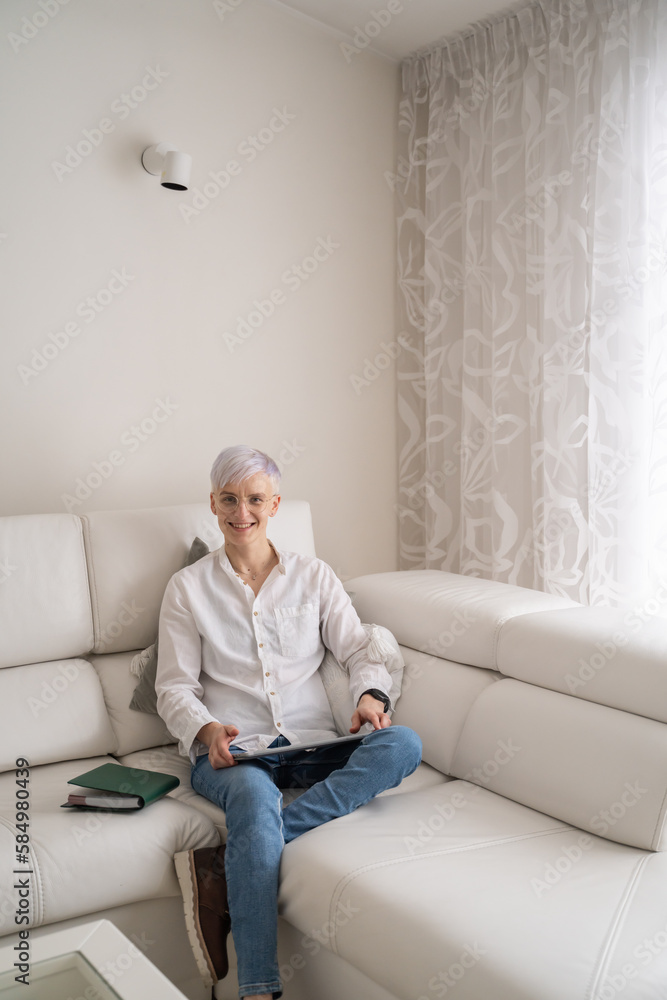 Portrait Of Woman Holding Tablet At Home Portrait Of Woman Holding Tablet At Home