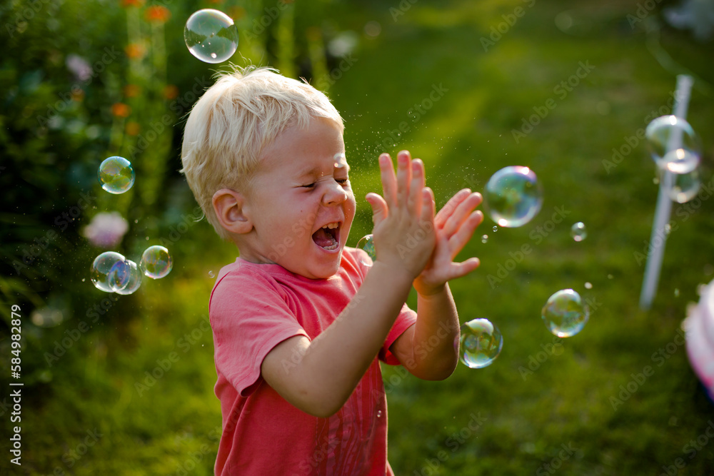 boy playing bubbles